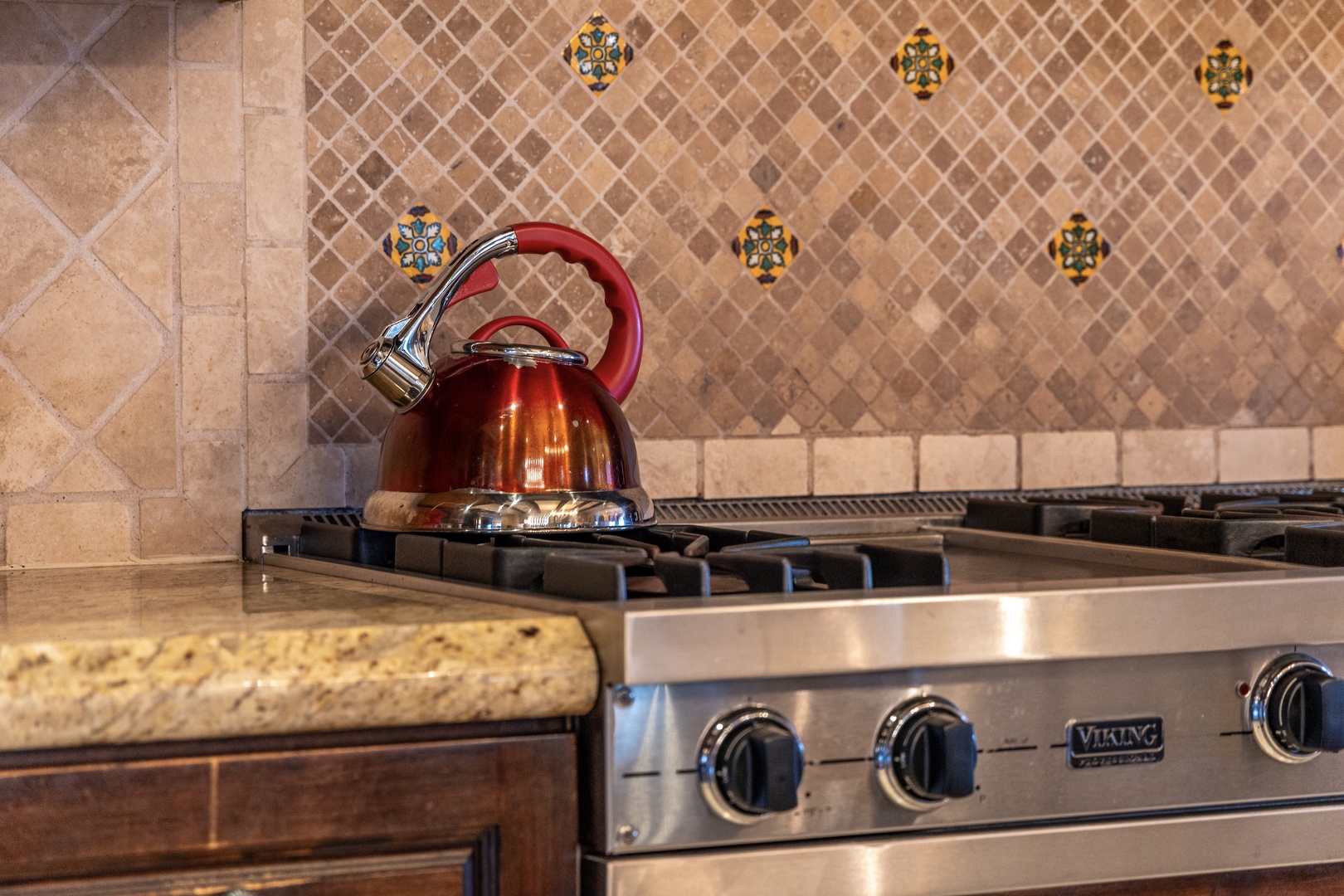 Picture yourself brewing morning tea in your fully equipped kitchen, featuring a professional-grade Viking range and custom tilework that adds warmth and character to your cooking experience.