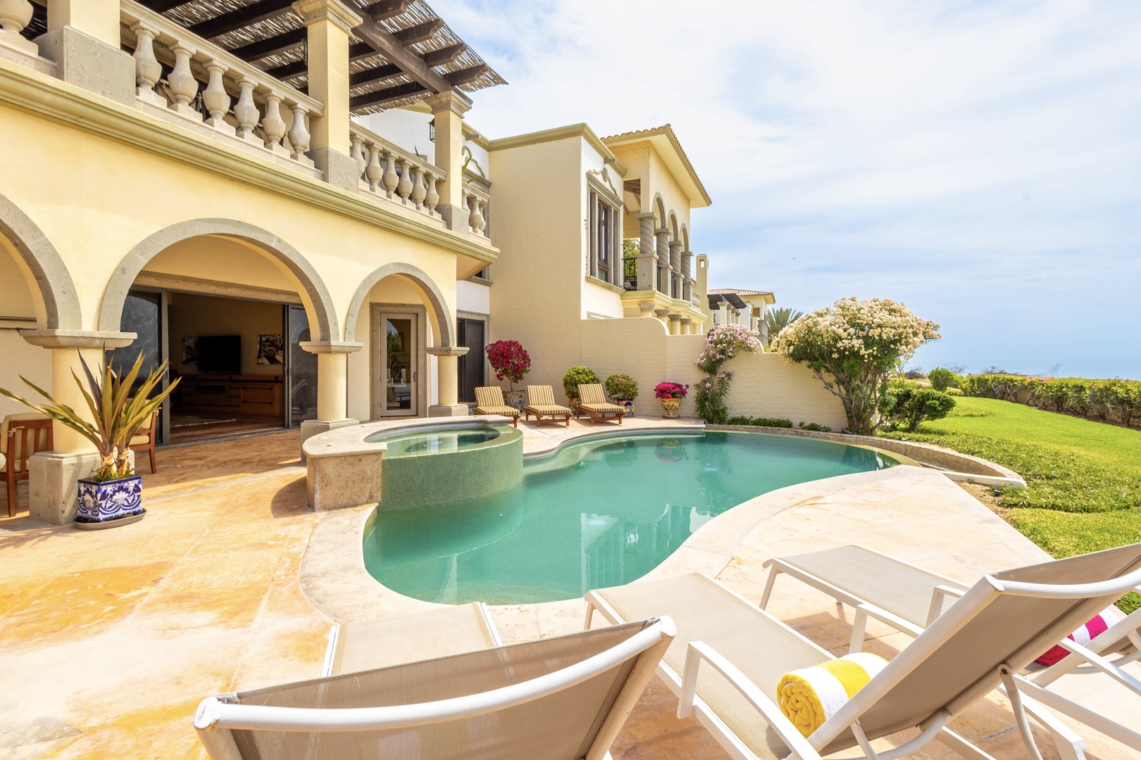 Mediterranean elegance meets coastal serenity. Lounge by your private pool, soak in ocean breezes, and let tropical gardens frame your perfect escape.