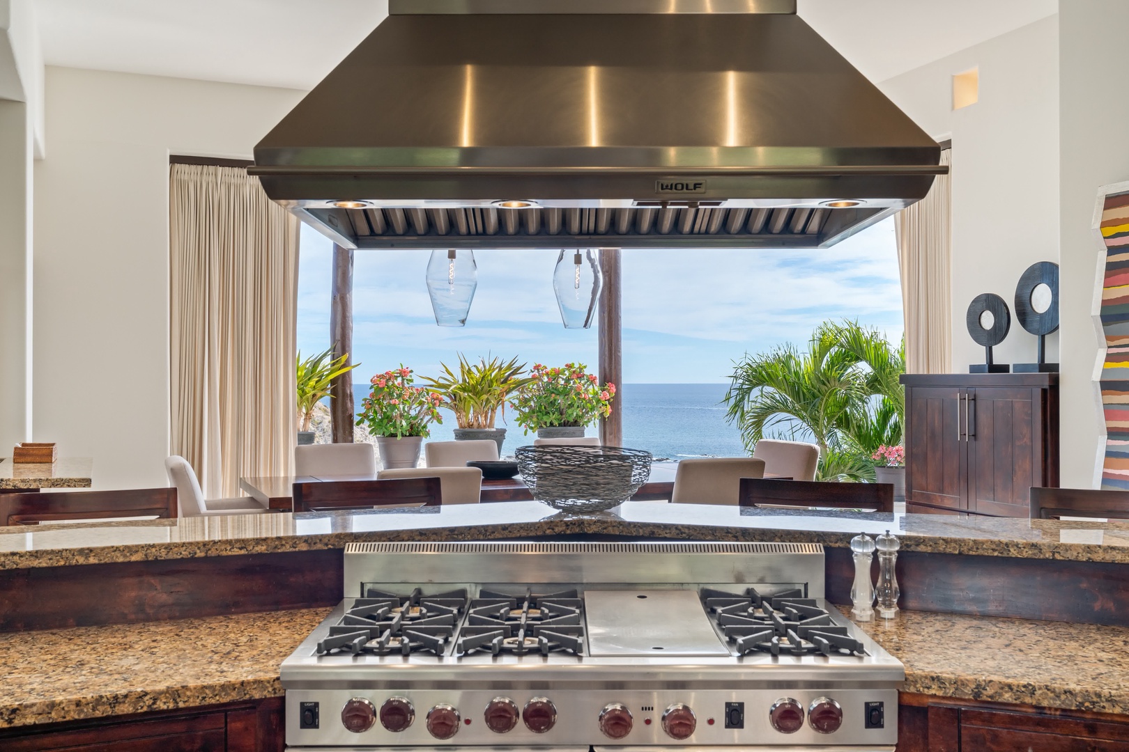 Cook while gazing at stunning ocean views from your gourmet kitchen with professional-grade appliances and tropical paradise just outside.
