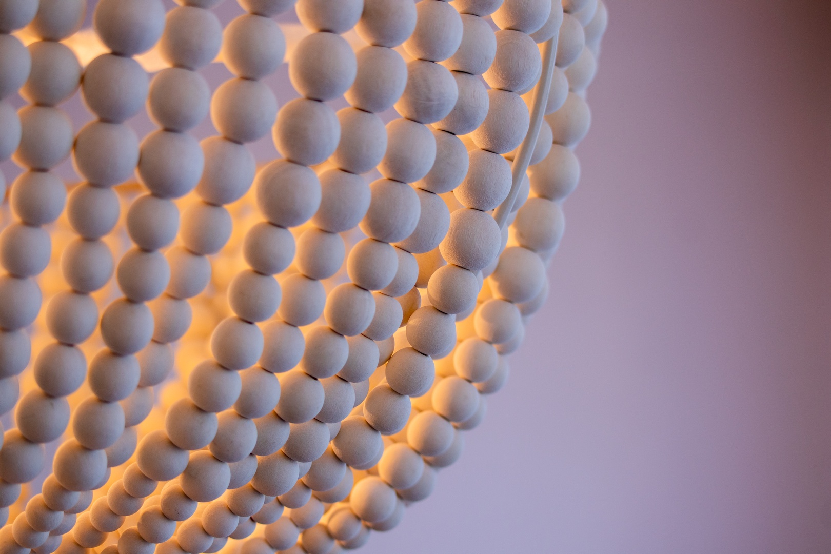 Soft ambient lighting filters through a textured decorative screen, creating a warm, calming glow that enhances your space with subtle elegance and relaxation.