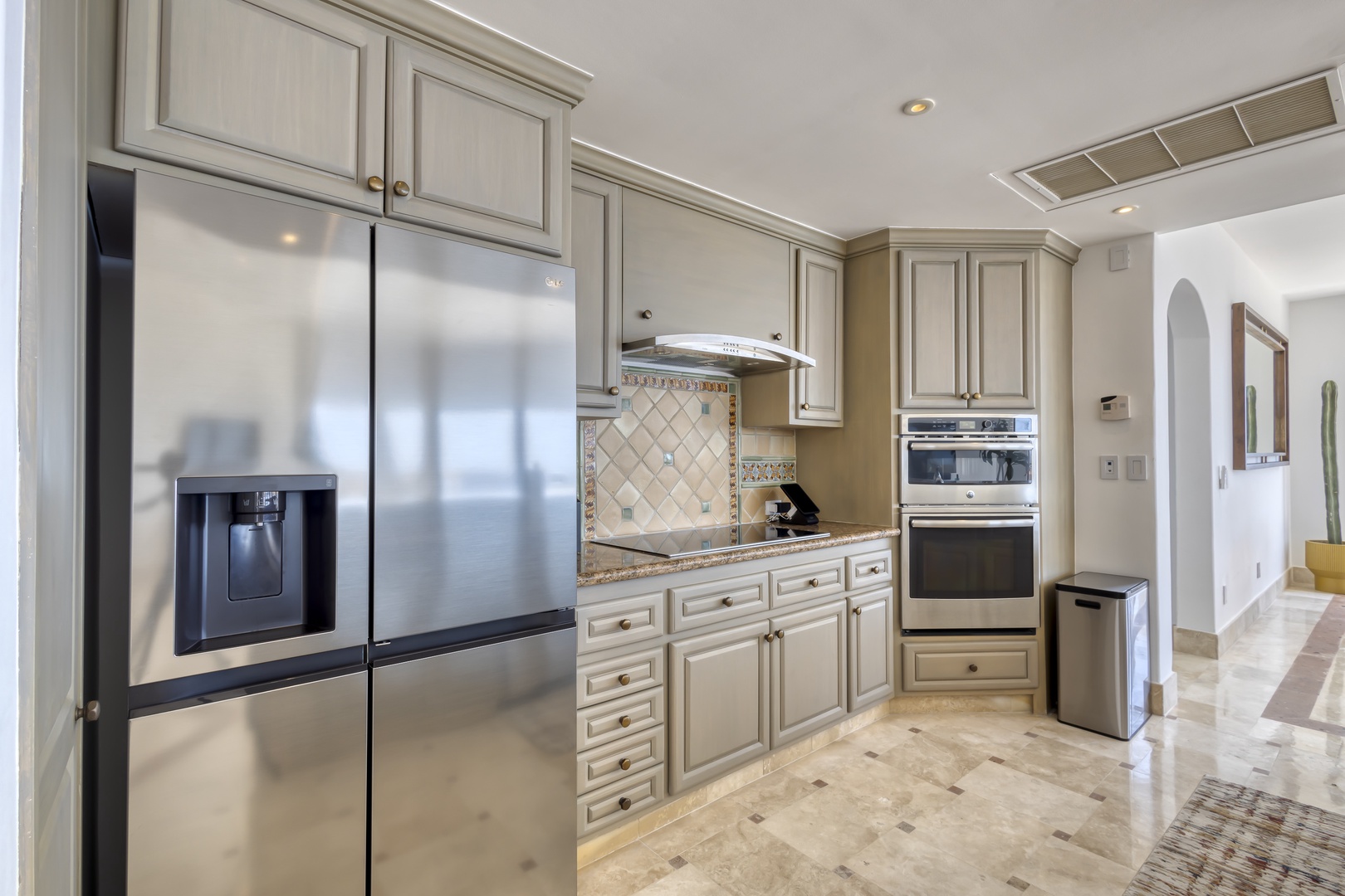 Your gourmet kitchen features stainless steel appliances, elegant cabinetry, and granite countertops—perfect for preparing delicious meals during your stay.