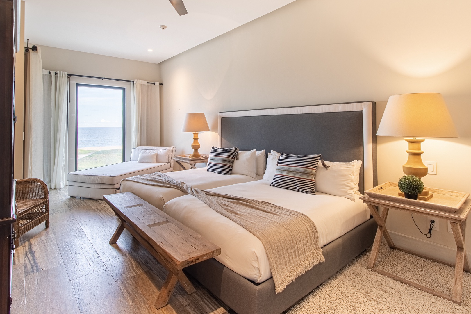 Wake up to stunning ocean views from your plush king bed, then relax on the cozy window seat as waves roll in just beyond the glass—pure coastal serenity awaits.