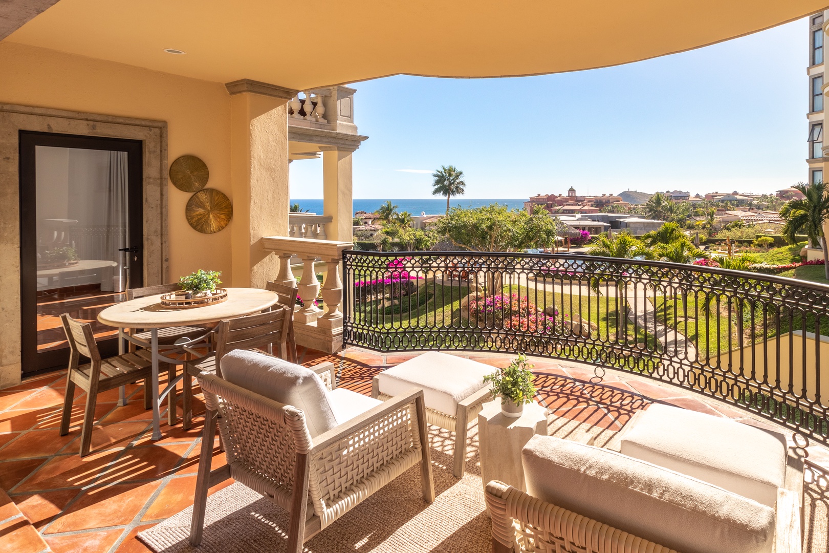 Picture yourself relaxing on your private terrace, soaking in sweeping ocean views and lush gardens below. This inviting outdoor space offers comfortable seating and a dining area perfect for your morning coffee or sunset dinners.