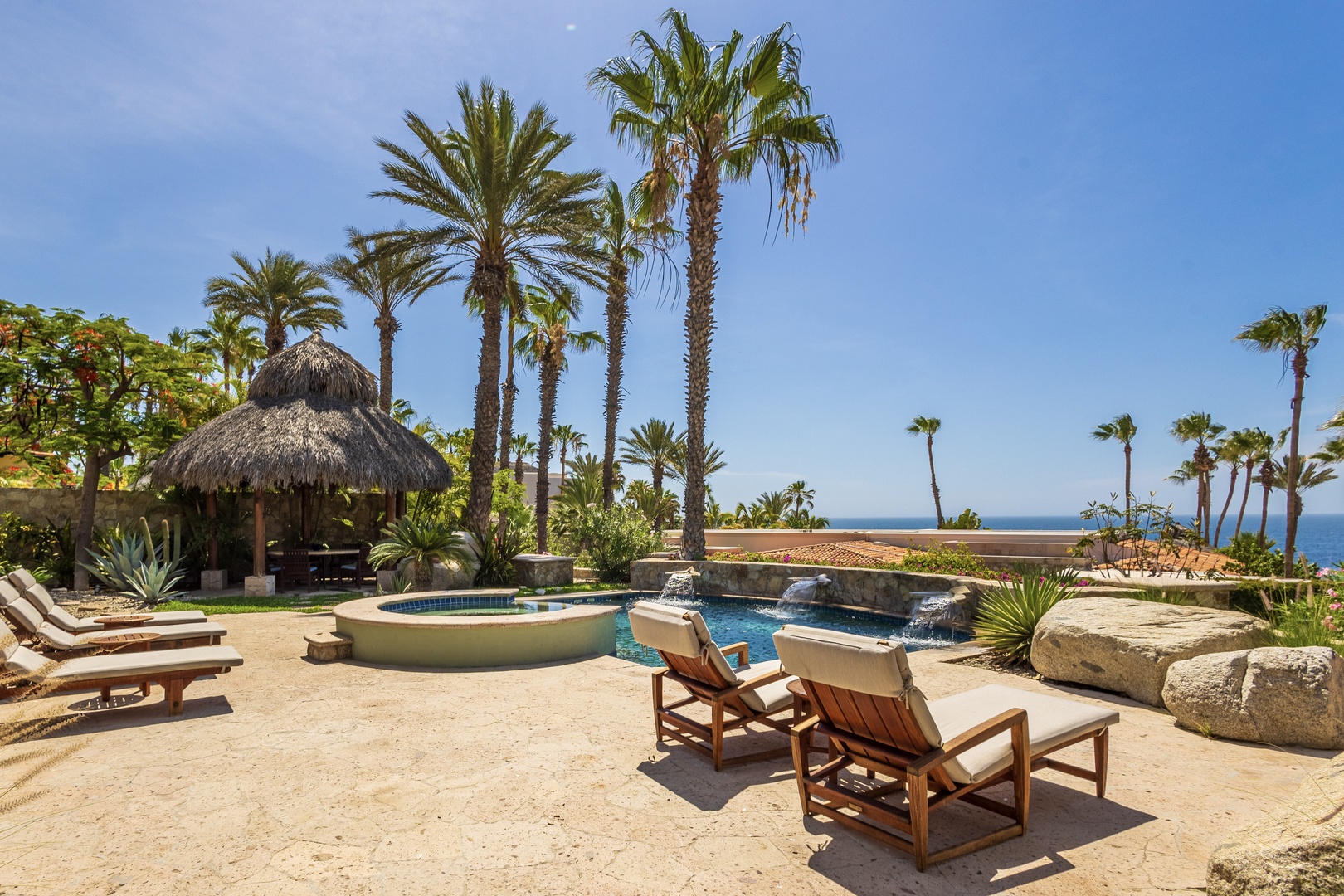 Lounge under swaying palms by your private pool and soak in stunning ocean views—your ultimate tropical escape awaits.