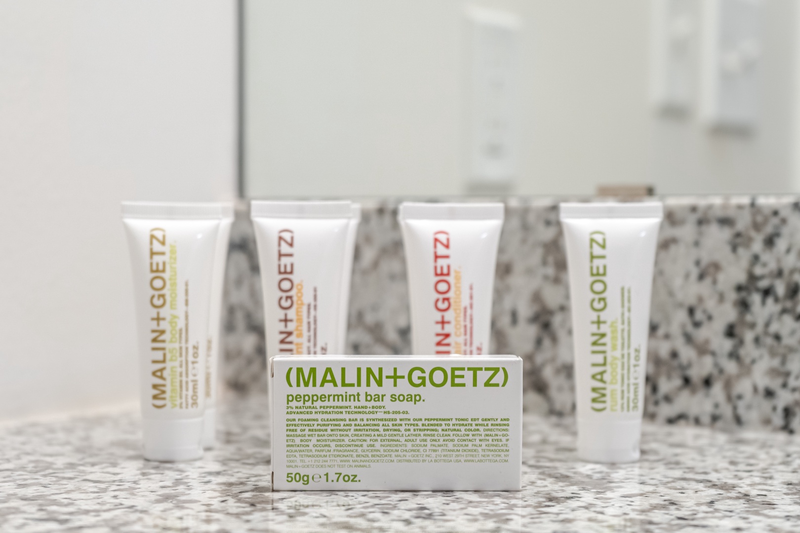 Treat yourself to complimentary toiletries by Malin + Goetz in the bathroom.