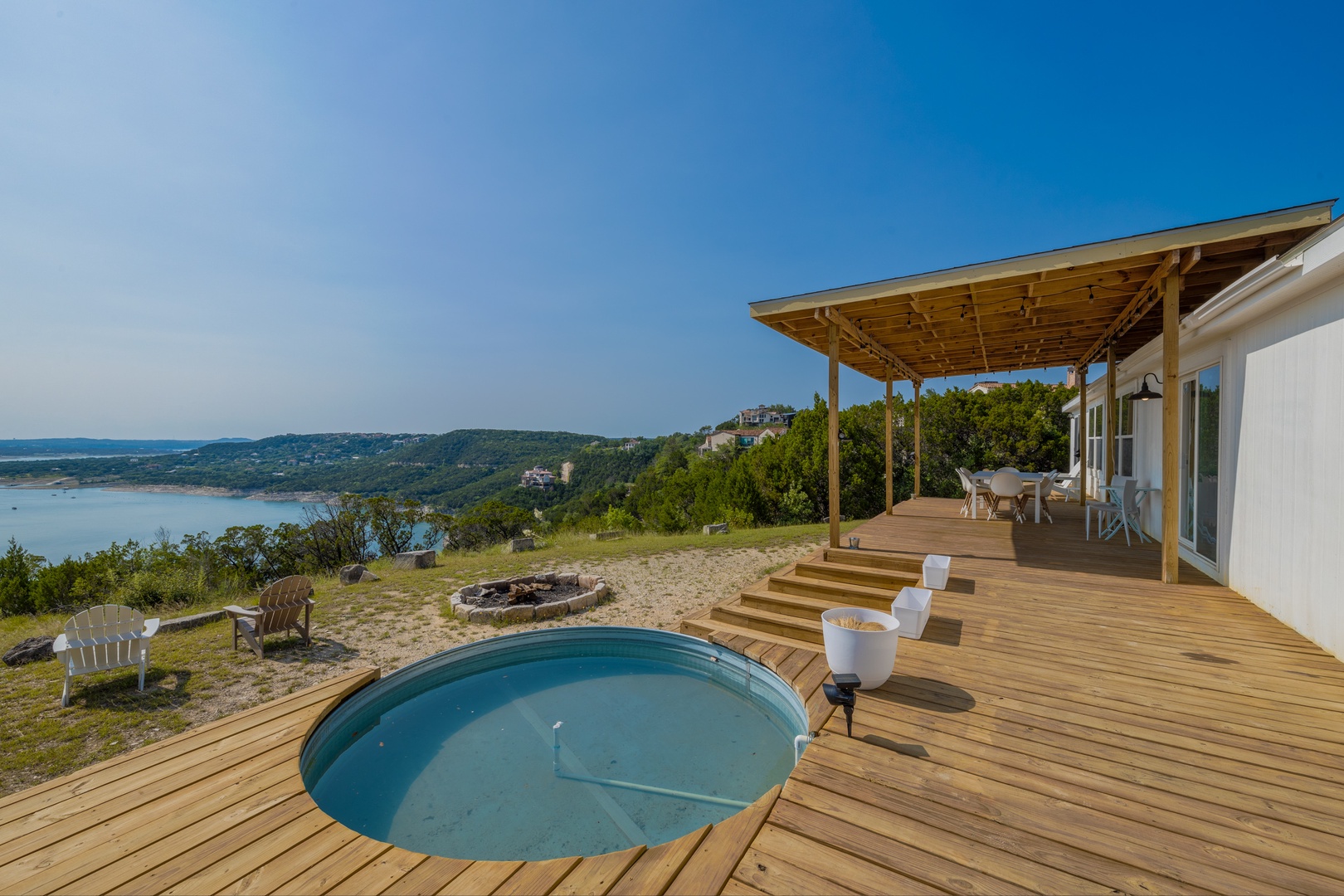Enjoy a dip in the Texas ranch-style pool at this lakefront property with amazing views