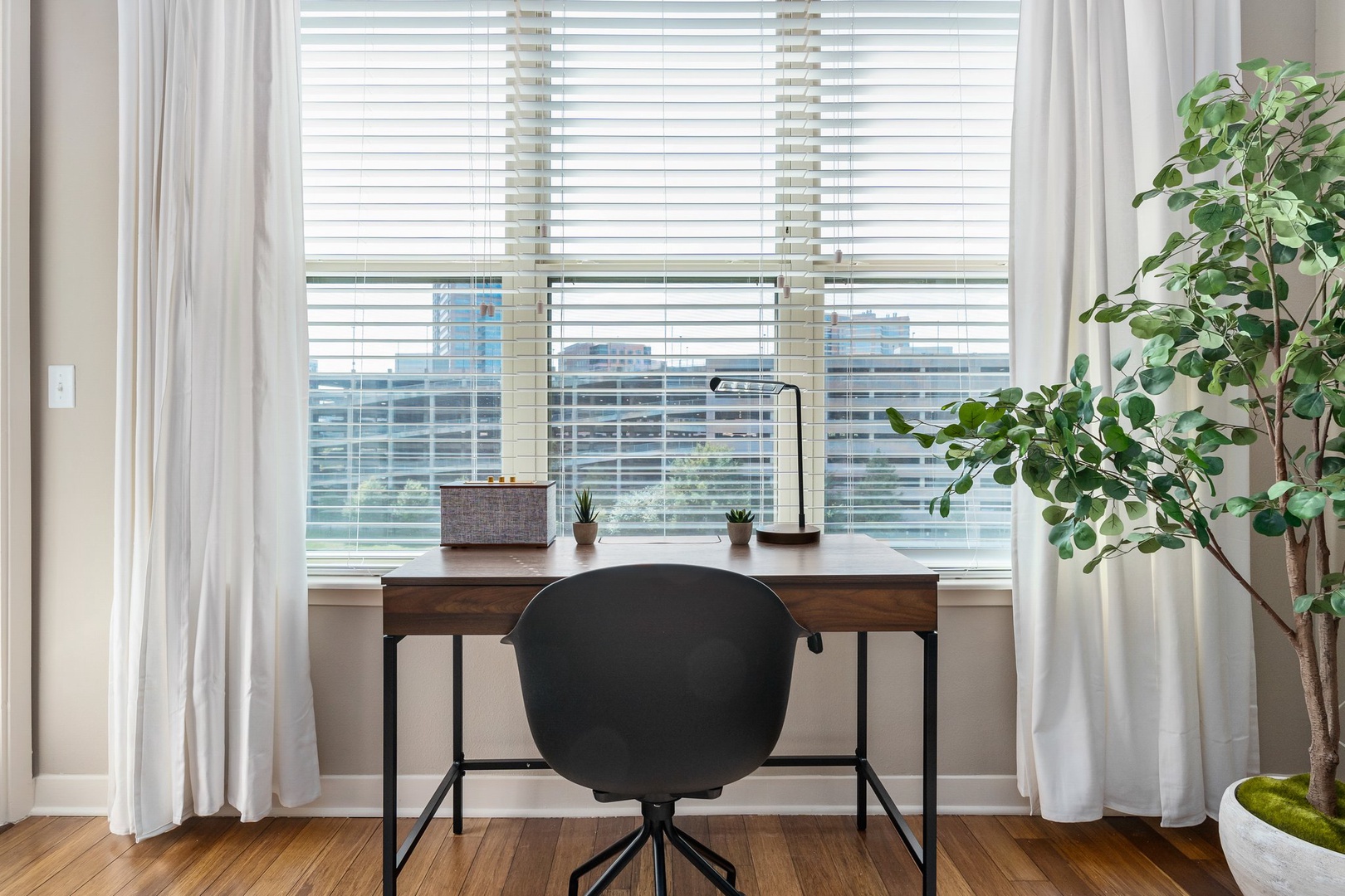 Stay productive in the dedicated desk area with ample natural light.