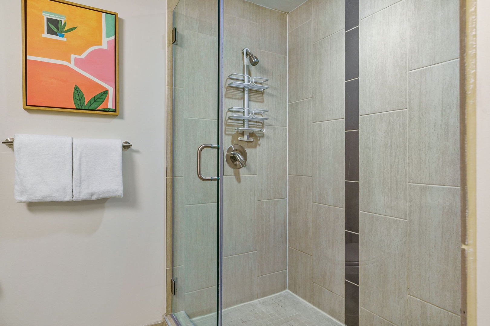 Feel invigorated in the modern walk-in shower with sleek fixtures.