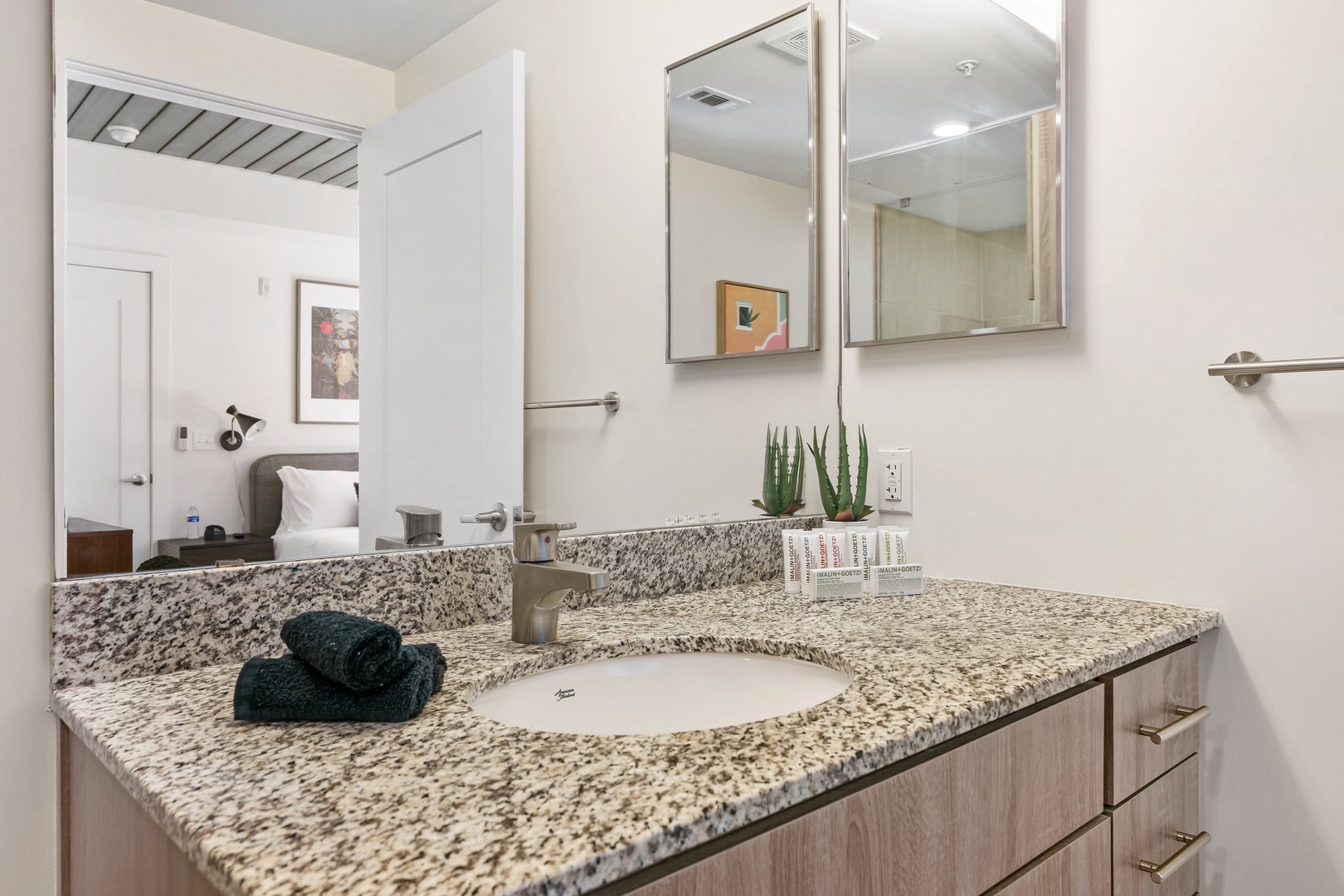 Rejuvenate in the sleek bathroom with complimentary toiletries.