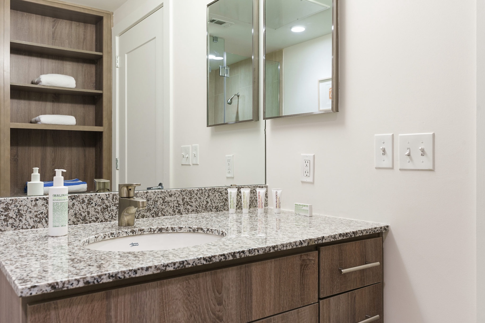 Prepare for the day in the modern bathroom with complimentary toiletries.