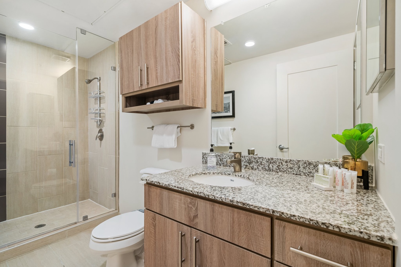 Freshen up in the sleek bathroom with complimentary toiletries.