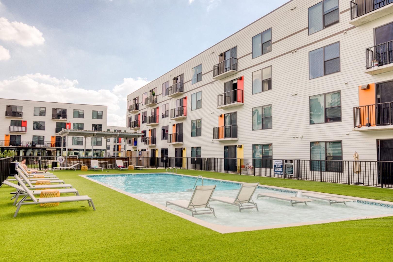 The apartment community features a swimming pool, one acre courtyard, and shared BBQ grills