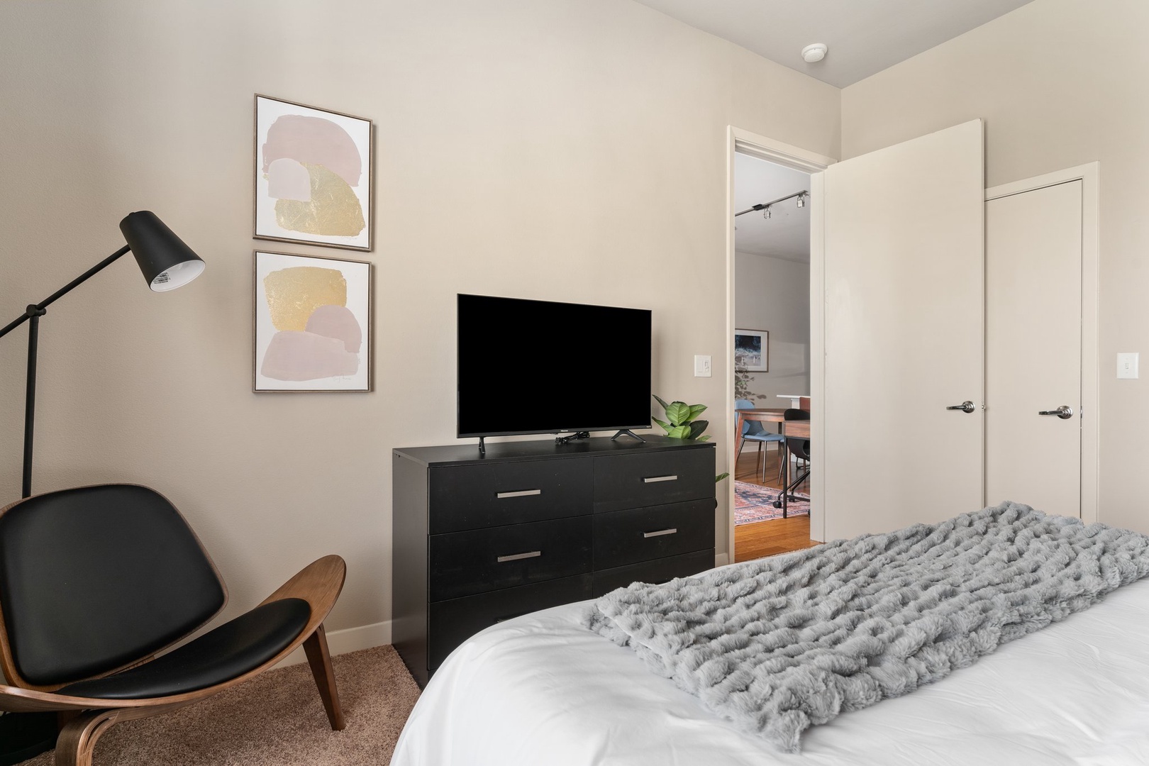 Experience a tranquil rest on a memory foam mattress in this cozy bedroom equipped with a  smart TV.