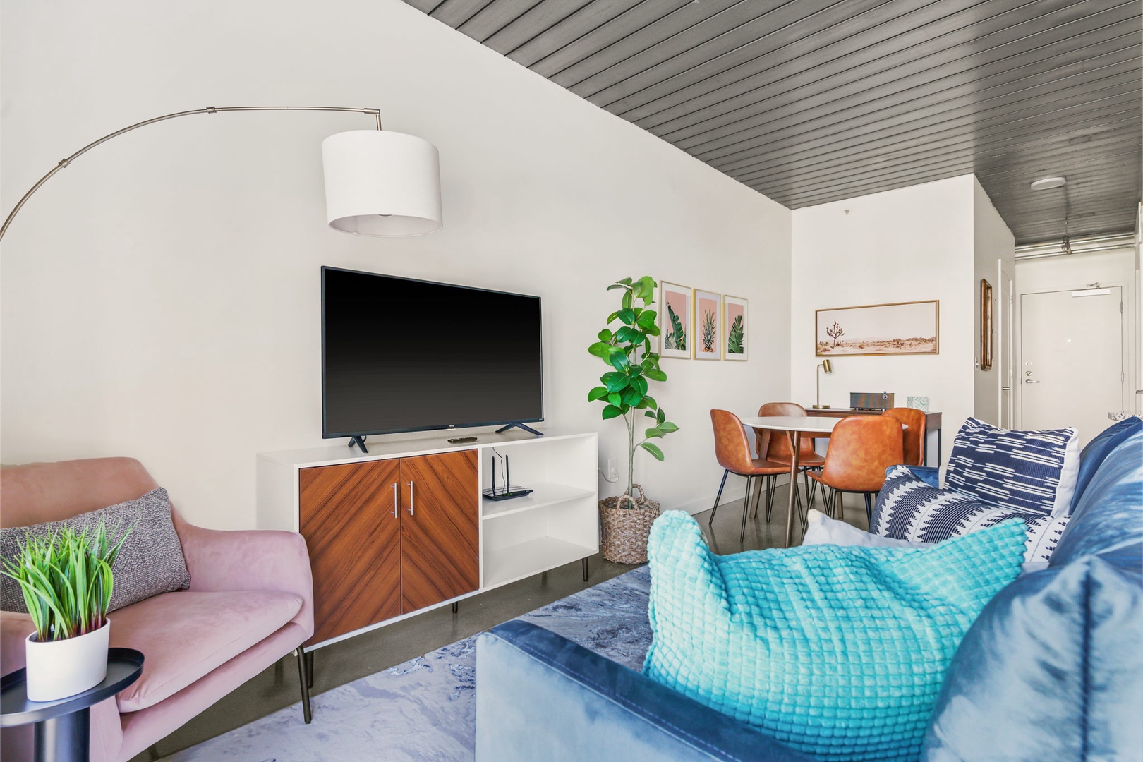 Snuggle in and enjoy the smart TV experience in this chic and comfortable modern living area.