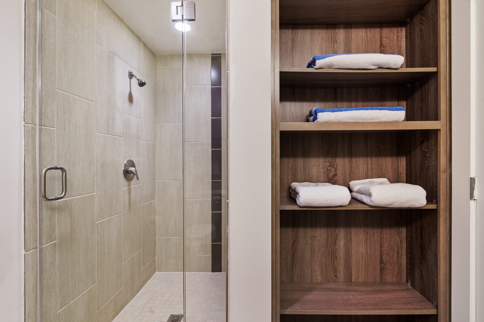 Renew in the updated walk-in shower with modern fixtures.