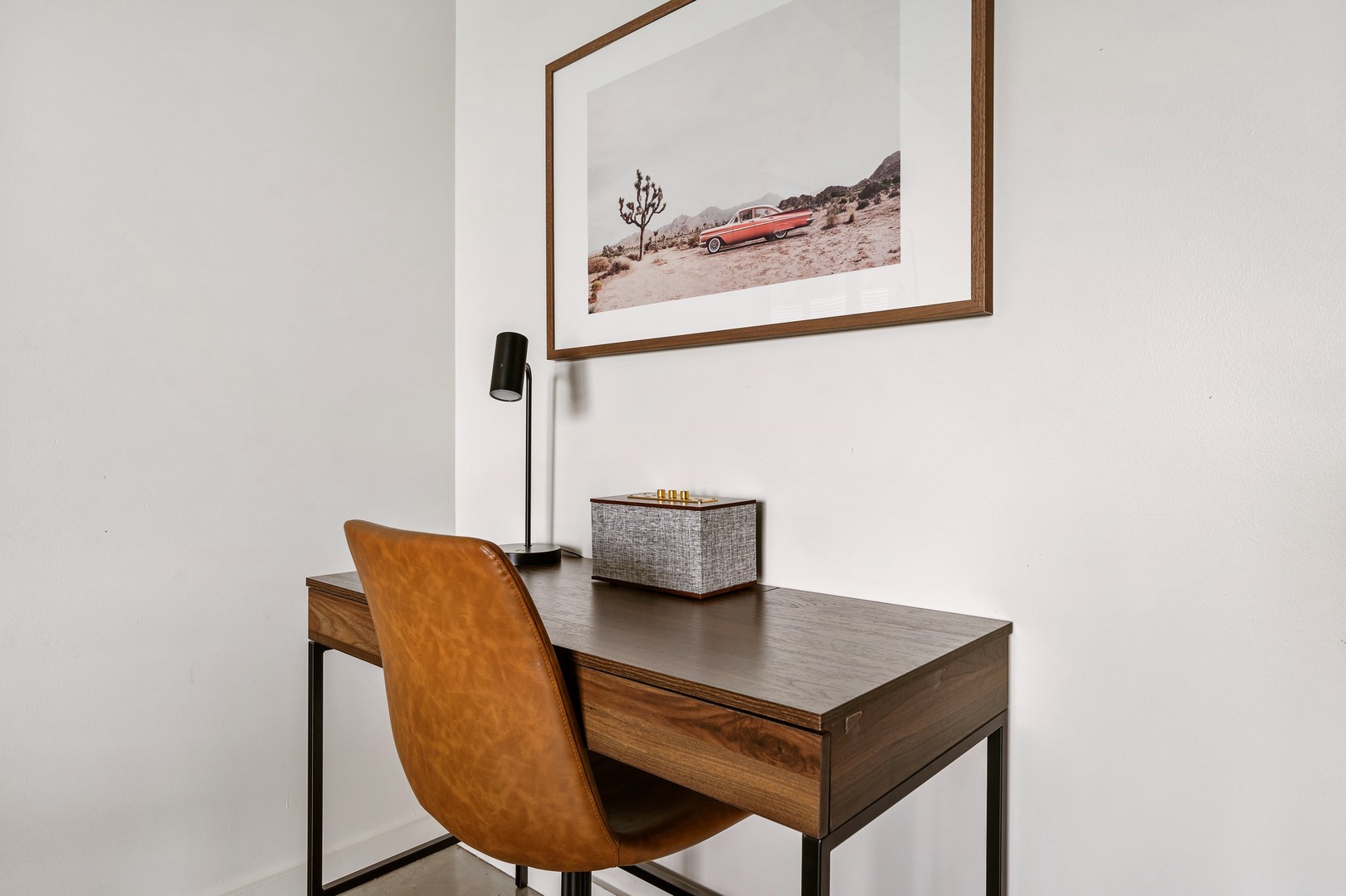 Work comfortably in the dedicated desk area with natural light.