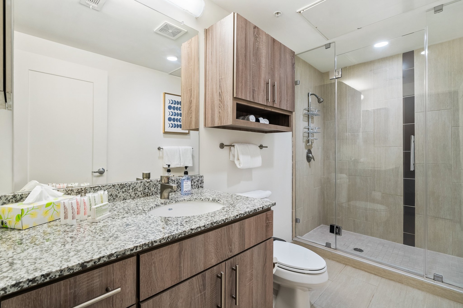 Freshen up in the sleek bathroom with complimentary toiletries.