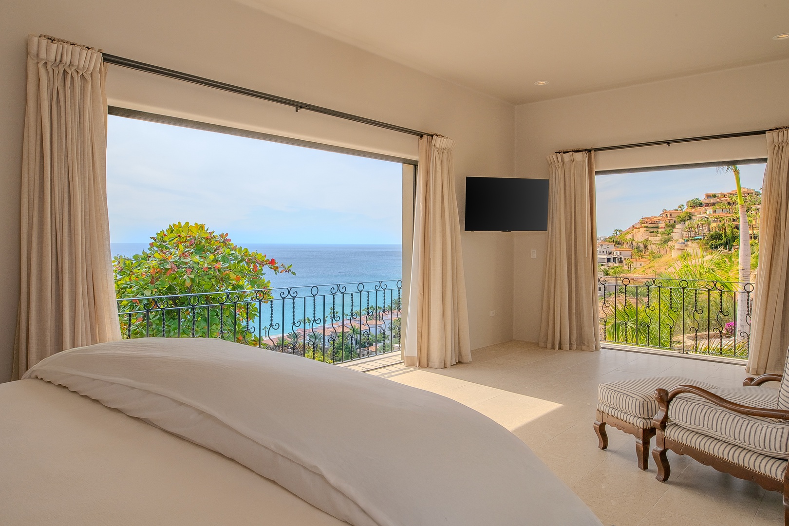 Wake up to breathtaking ocean views from your private retreat, where azure waters meet the horizon beyond your balcony.