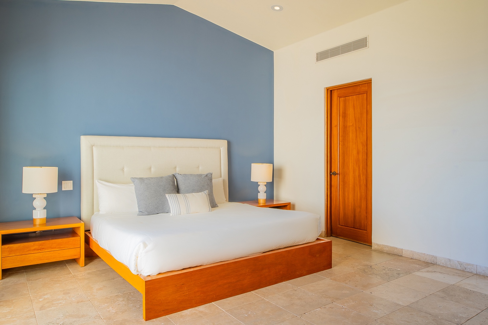 Drift into restful sleep surrounded by calming coastal hues and premium linens. Your peaceful retreat features a plush bed, modern comfort, and gentle lighting to ensure rejuvenation.
