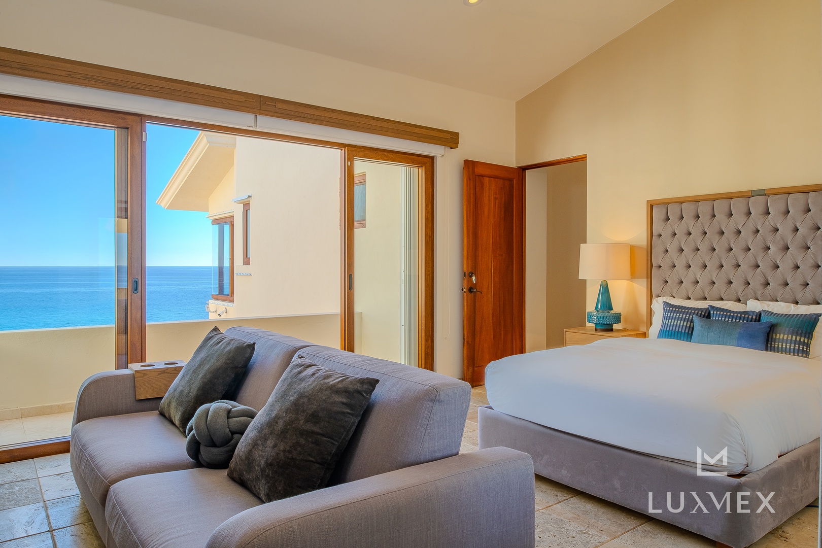 Wake up to stunning ocean views from your elegant bedroom, where comfort meets coastal luxury in perfect harmony.