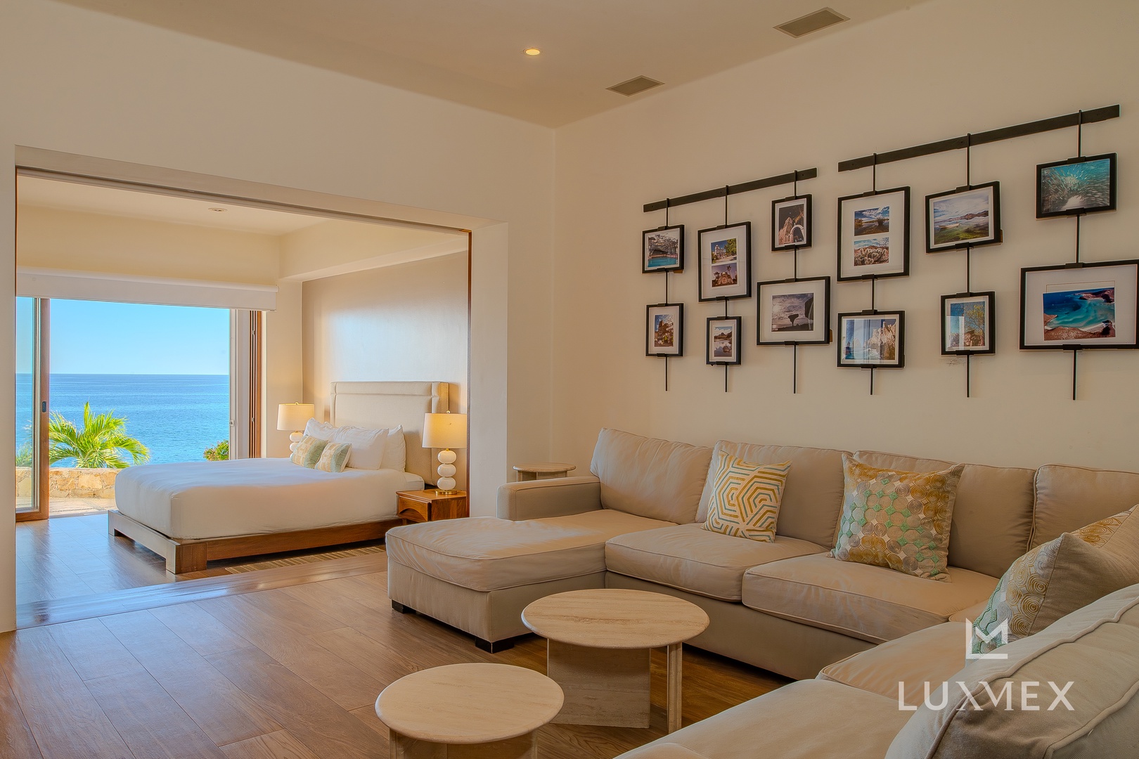 Relax in your spacious suite with stunning ocean views and elegant coastal artwork adorning the walls.