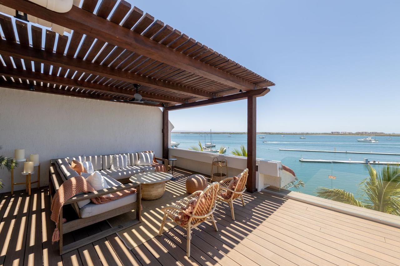 Unwind on the shaded terrace with serene water views, plush seating, and gentle breezes—your perfect spot to relax, read, or watch boats glide by.