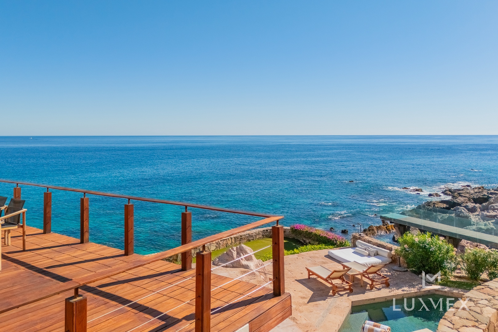 Stunning ocean terrace with pristine waters stretching to the horizon, perfect for peaceful mornings and spectacular sunsets.