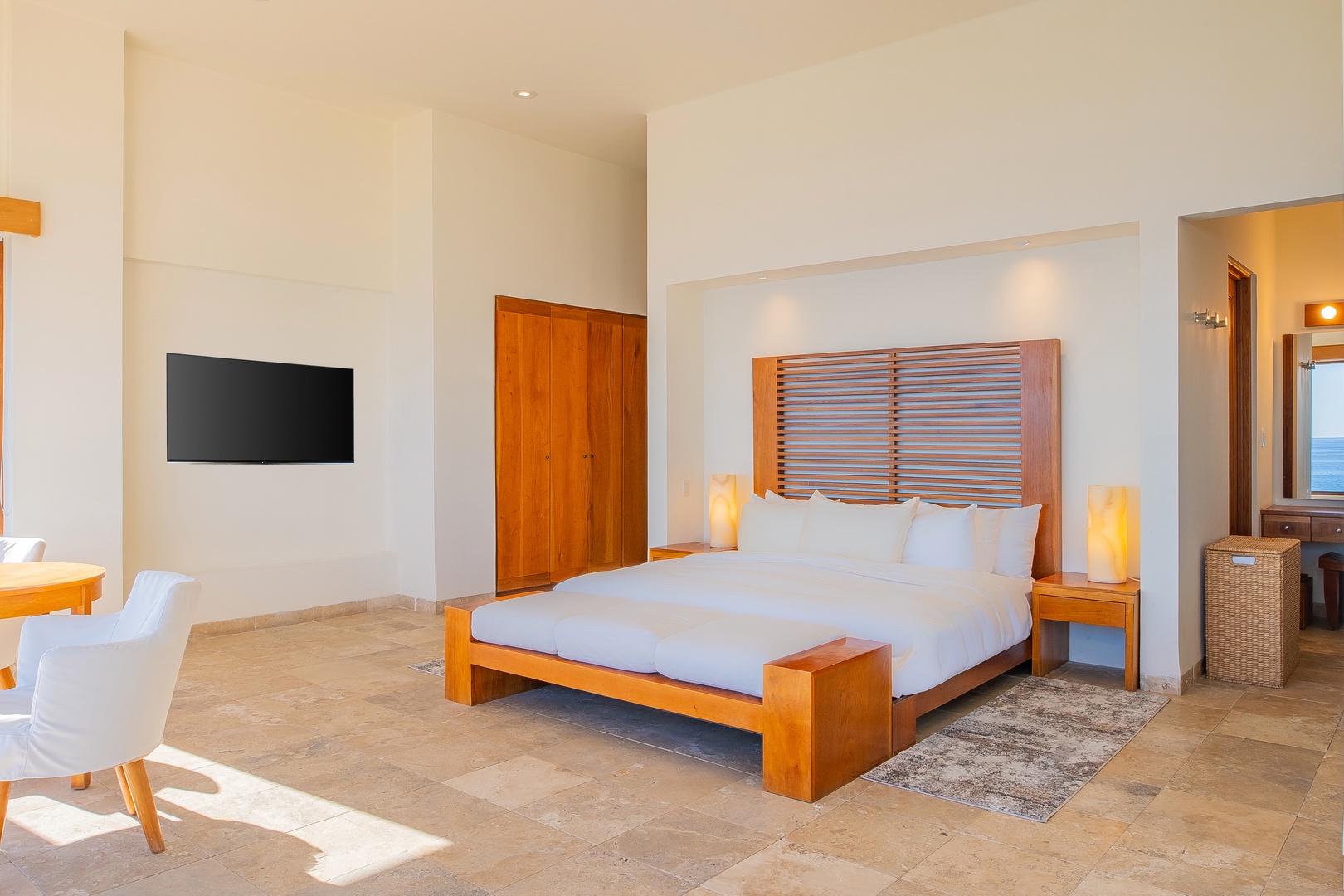 Sink into crisp linens and let the calming ocean views wash over your senses. Your personal sanctuary awaits, complete with modern comforts and peaceful ambiance.
