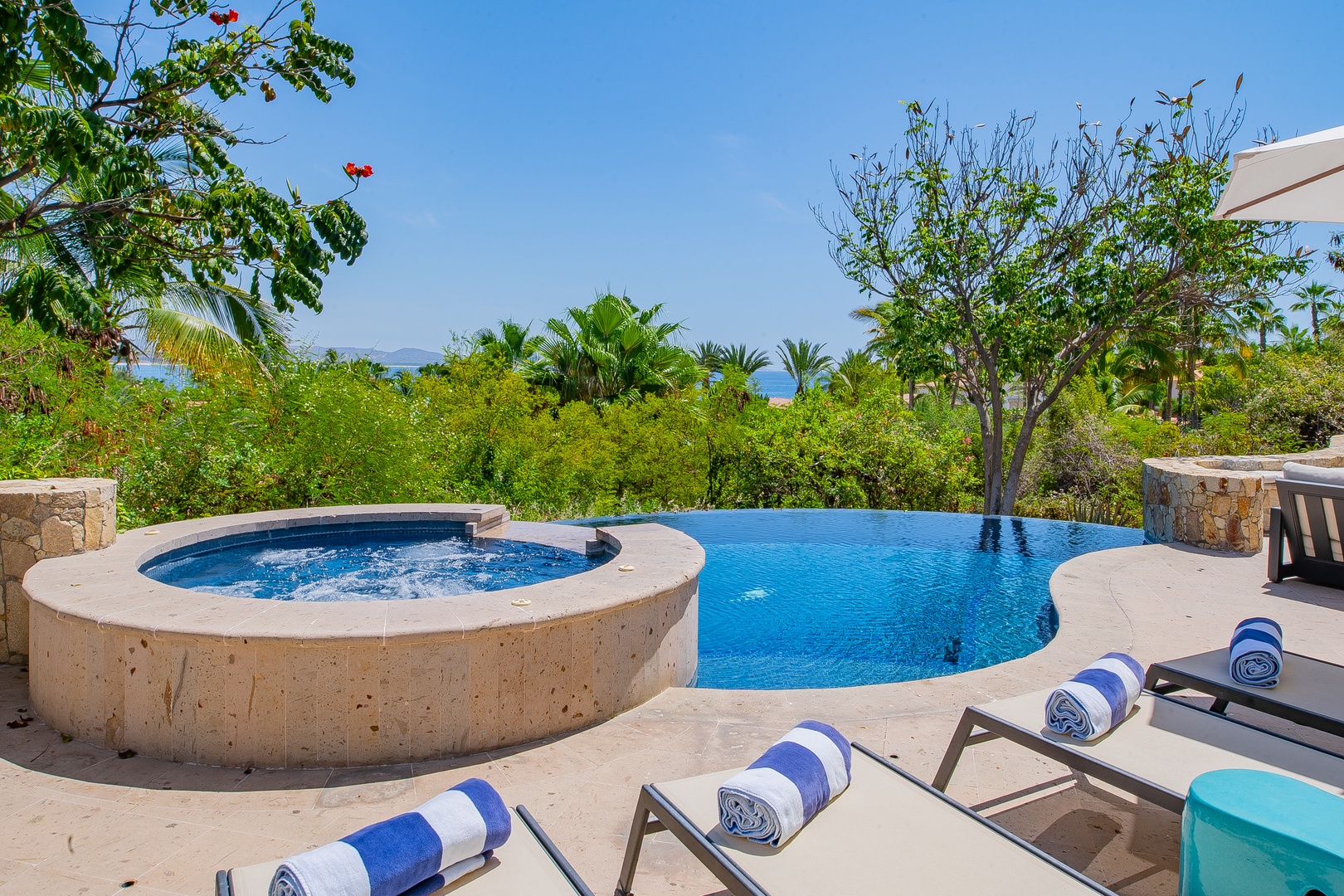 Take a refreshing dip in your private infinity pool or soak in the bubbling hot tub while gazing at lush tropical greenery and sparkling ocean views.