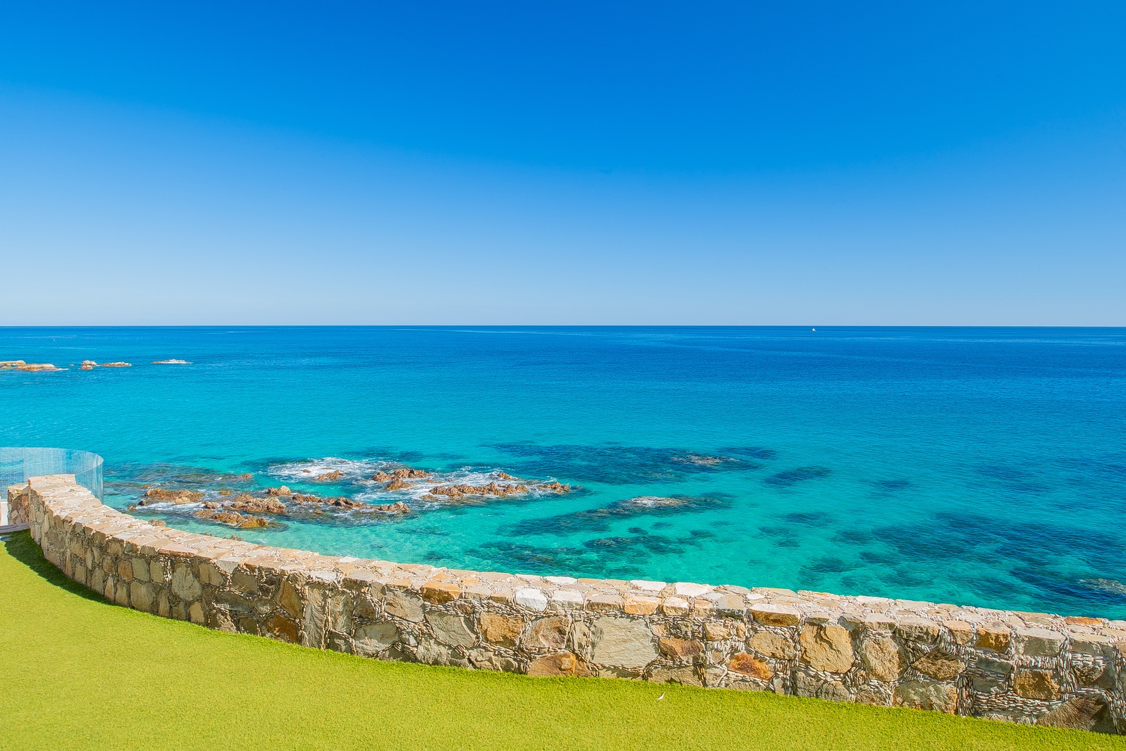 Oceanfront property with stunning turquoise waters and pristine coastline views, offering an idyllic Mediterranean setting for a peaceful retreat.