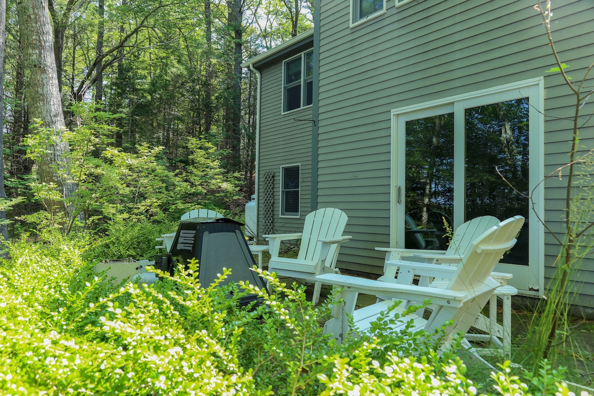 Settle into your own serene woodland escape, where Adirondack chairs and lush green surroundings invite you to unwind with a morning coffee or evening read.