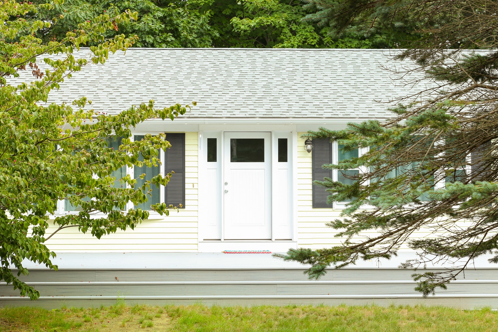 Charming home nestled among lush greenery, offering a peaceful retreat surrounded by nature.