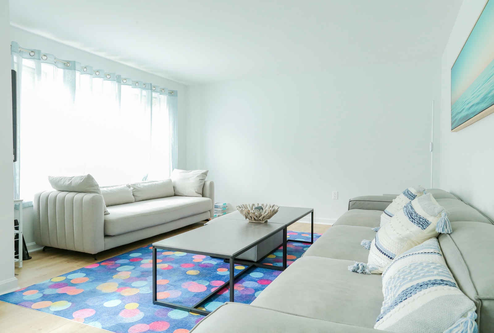 Sink into plush seating in your bright, airy living room. Soft coastal colors and fresh white curtains create a serene retreat where you can unwind after a day of adventure.