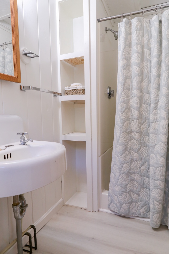 Refresh after a day of exploring in your bright, coastal-inspired bathroom. The walk-in shower and thoughtful built-in storage make unwinding effortless.