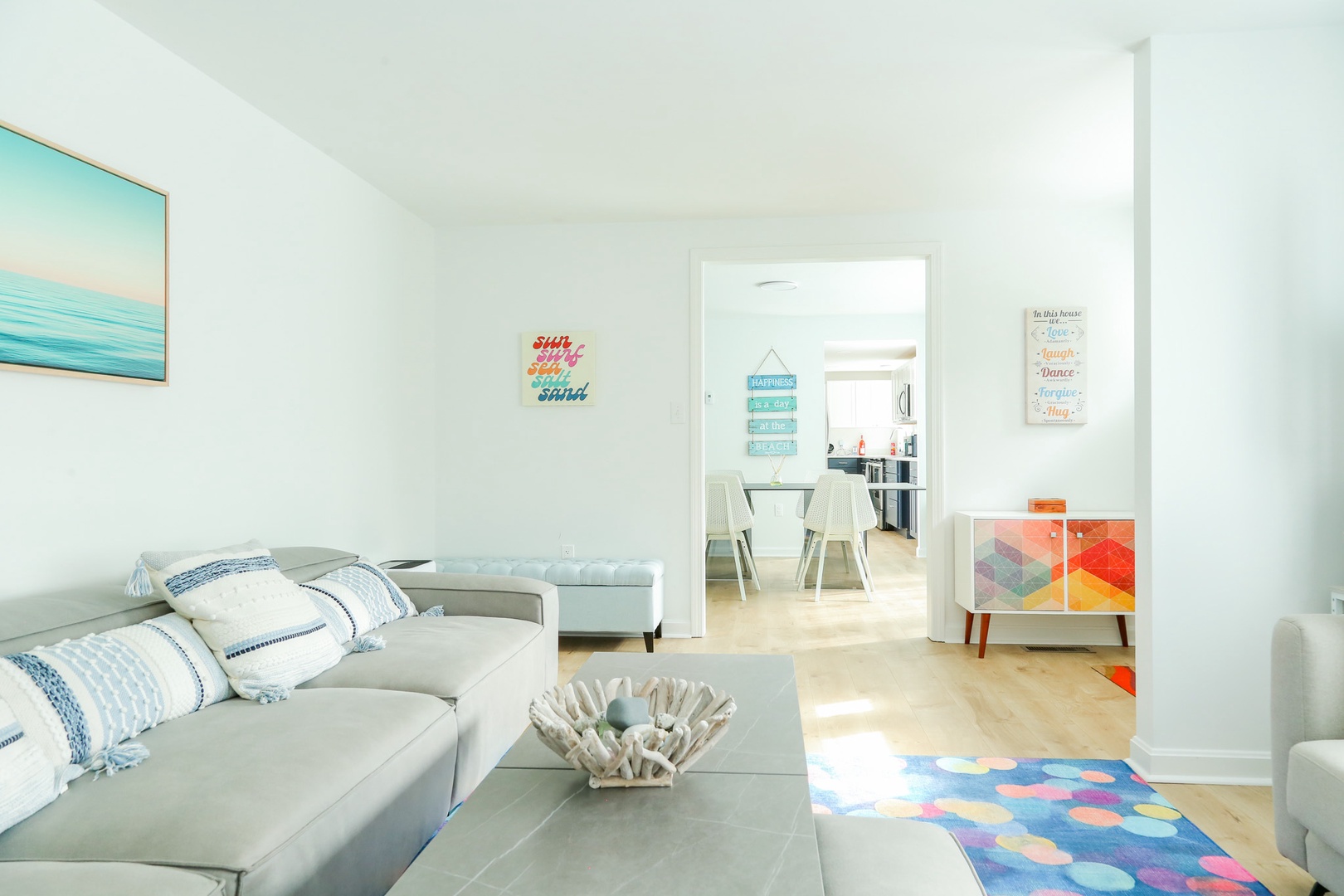 Settle into this bright, airy living space where soft neutrals and coastal touches invite you to relax. Thoughtful pops of color and an open layout create your perfect spot to unwind.