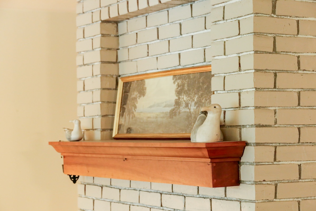 Charming details like the wooden mantel and vintage décor add character and warmth to your retreat.
