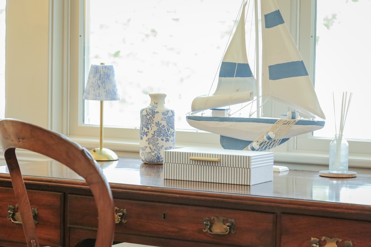 Bright coastal charm greets you in this thoughtfully styled space, where natural light floods through large windows and nautical touches set a serene, breezy tone for your stay.
