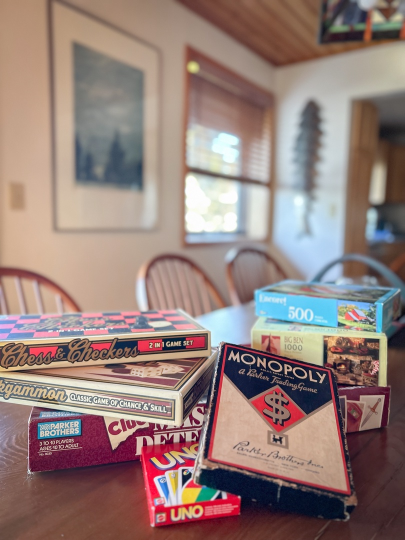 Gather around for game night! Classic board games and puzzles await your family fun in this cozy dining space.