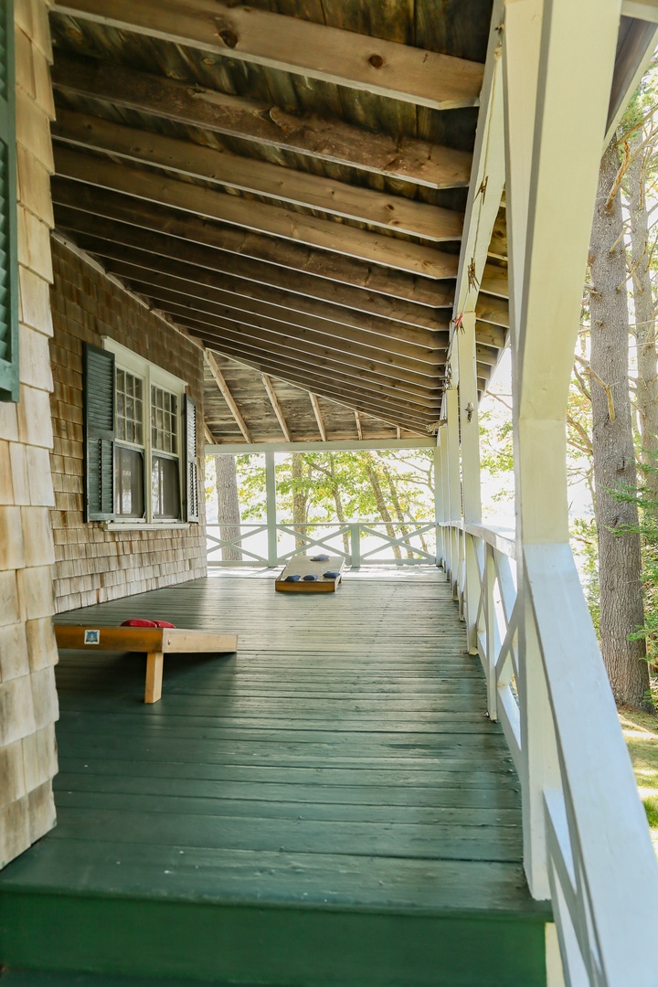 Step onto your private wraparound porch - how about a game of corn hole?!