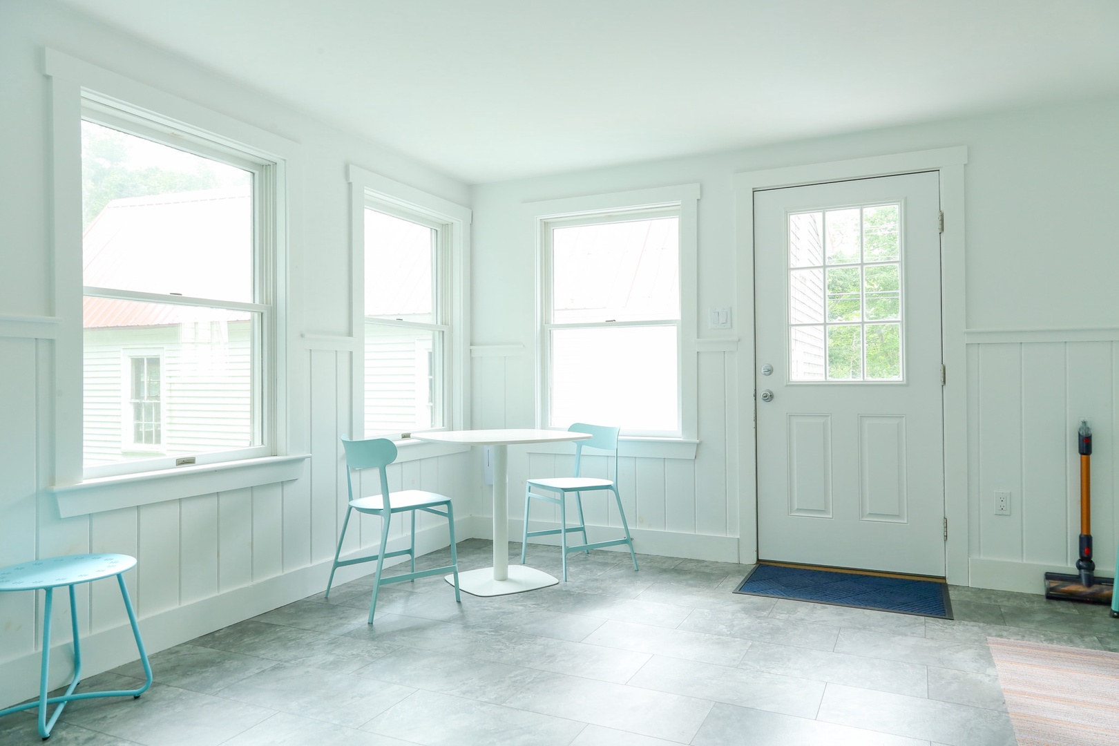Light-filled space with fresh coastal colors and cozy seating—perfect for your morning coffee or planning the day ahead.