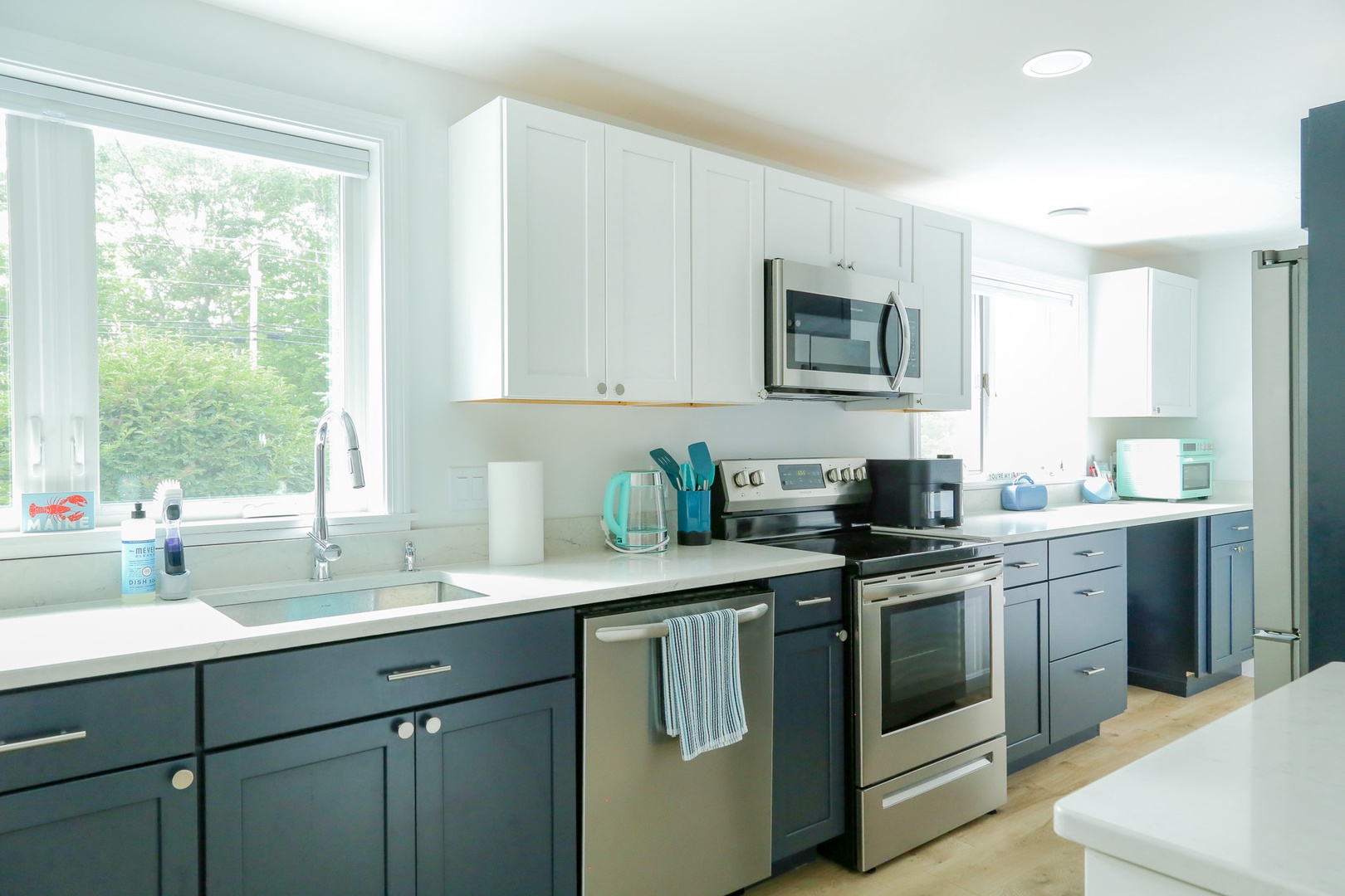 Modern kitchen with stainless appliances and garden views, perfect for preparing your favorite meals during your stay.