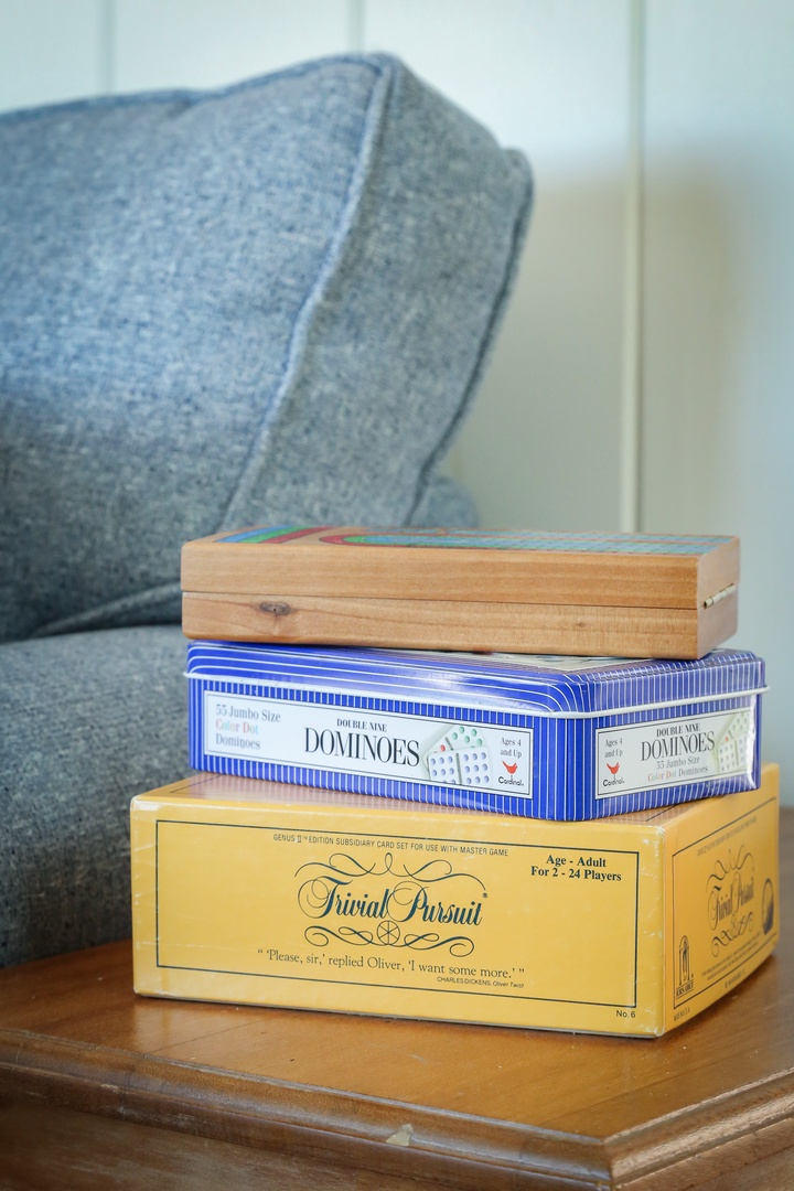 Cozy up with classic board games stacked beside your comfy seating. Perfect for relaxing game nights during your stay.