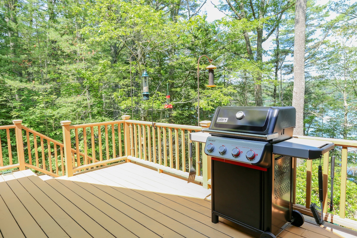 Imagine grilling your favorite meals on this spacious deck surrounded by towering trees and tranquil forest views. The perfect spot to unwind and savor nature's serenity.
