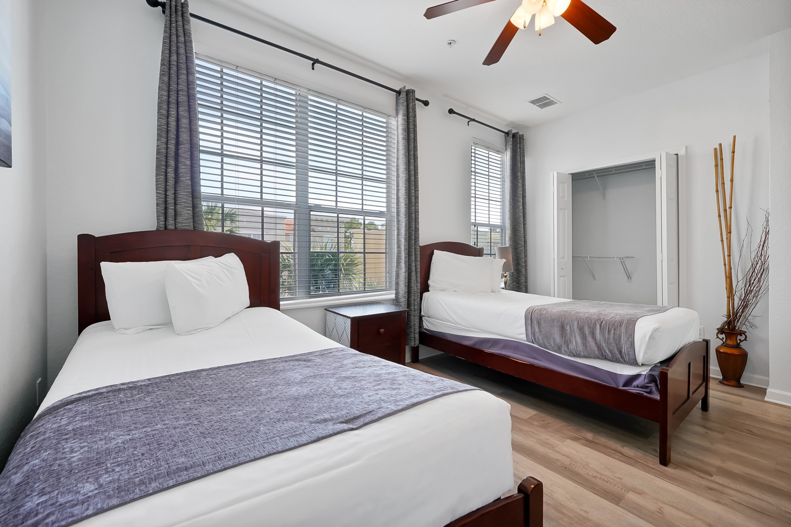 Rest peacefully in your twin bedroom with crisp linens and warm wood finishes creating the perfect retreat.