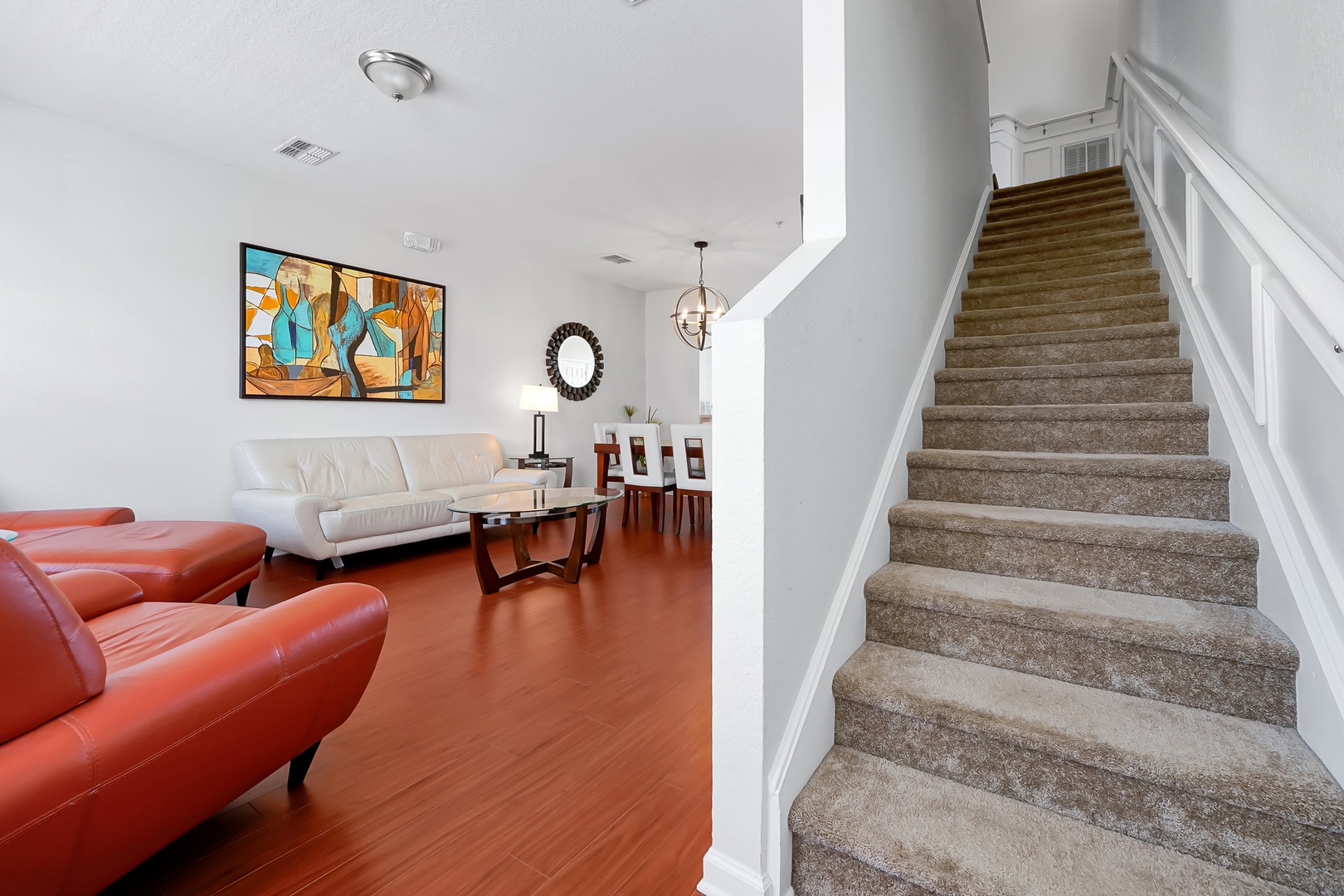 Relax in your stylish living space with modern furnishings, vibrant art, and an open layout perfect for unwinding after exploring.