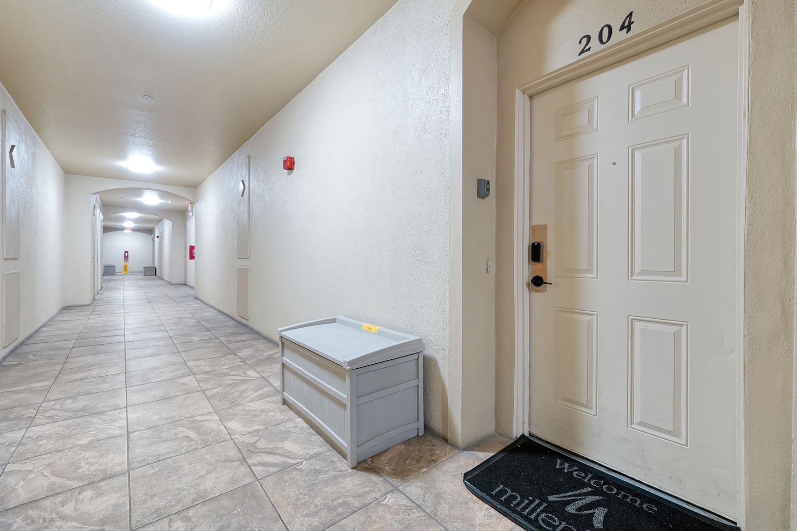 The property is located in a well-maintained building with modern finishes, featuring clean hallways, tiled flooring, and thoughtful design details throughout.