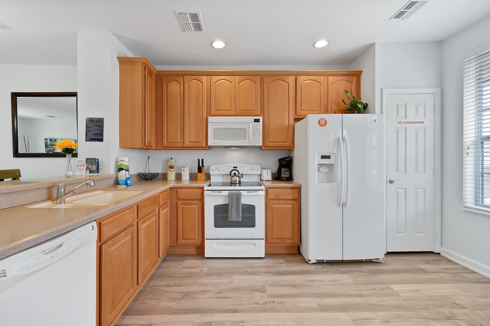 Your fully equipped kitchen awaits with warm wood cabinets, modern appliances, and everything you need to prepare memorable meals during your stay.