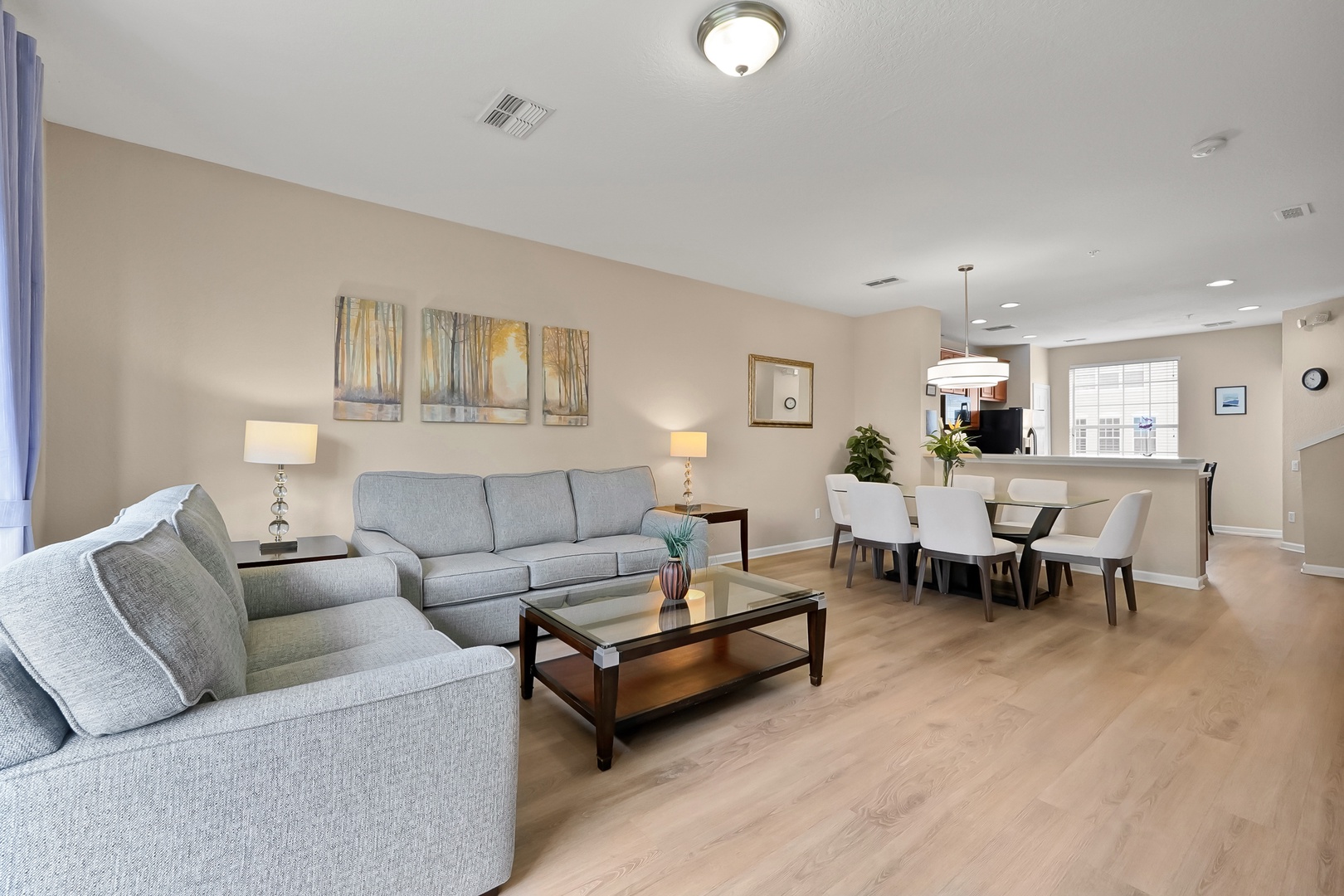 Relax in your spacious open-plan living area with plush seating, elegant décor, and seamless flow to the dining space for memorable gatherings.