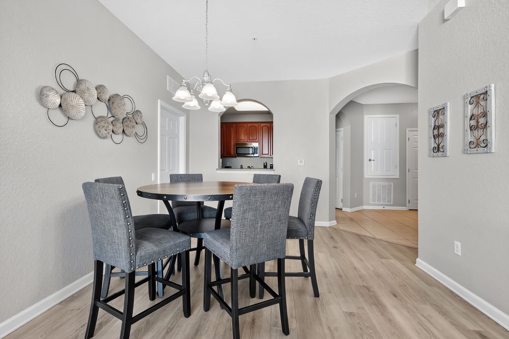 Gather around your elegant dining table for memorable meals together, with stylish seating and warm pendant lighting creating the perfect atmosphere.