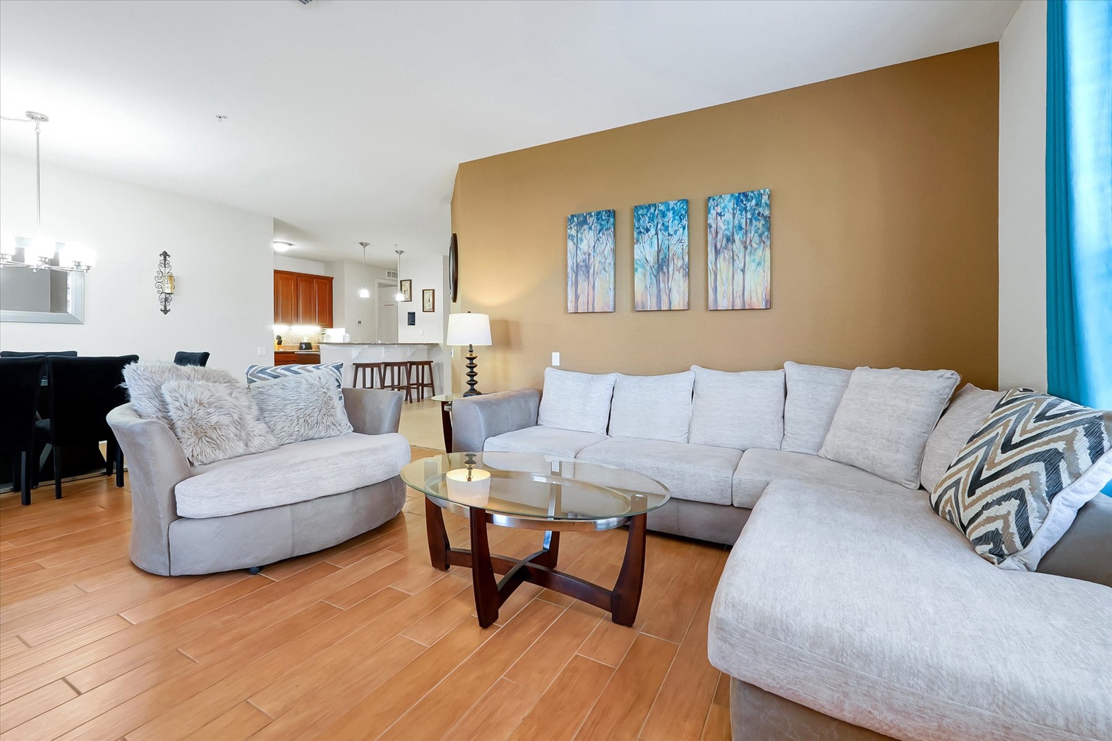 Unwind in your spacious living room with plush sectional seating, perfect for movie nights or relaxing with loved ones after exploring.